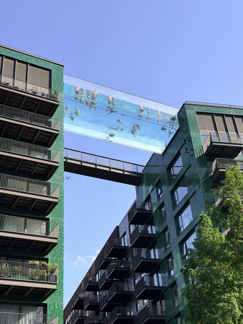 The Sky Pool bridging two Embassy Gardens buildings against a blue sky